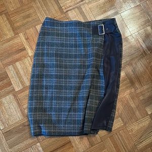 Modi’s pencil plaid skirt.